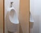 Closeup shot of wall-mounted urinal