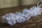 Closeup shot of a wedding garter on a blurred background