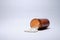 Closeup shot of white tablets fallen out brown bottle on white background