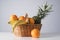 Closeup shot of a wicker straw basket with an assortment of fruits isolated on a white background