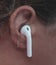 Closeup shot of a wireless headphone on female ear