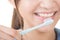 Closeup shot of woman brushing teeth