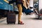 Closeup shot of woman feet standing on tiptoe while embracing her man at railway platform for a farewell before train