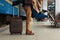 Closeup shot of woman feet standing on tiptoe while embracing her man at railway platform for a farewell before train