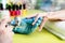 Closeup shot of a woman in a nail salon receiving a manicure by a beautician with nail file. Woman getting nail manicure