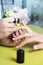 Closeup shot of a woman in a nail salon receiving a manicure by a beautician with nail file. Woman getting nail manicure. Beautici