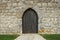 Closeup shot of a wooden door into an old building - perfect for background