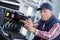 Closeup shot young male technician repairing digital photocopier machine