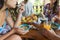 Closeup Shot Of Young People While Eating Noodles Soup Group Of Friends Enjoy Traditional Asian Food While Dining