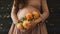 closeup show of pregnant woman, future mother hand with flower on belly, pregnancy concept