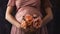 closeup show of pregnant woman, future mother hand with flower on belly, pregnancy concept