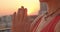 Closeup side view portrait of spiritual caucasian female with dreadlocks practicing yoga smiling cheerfully on rooftop