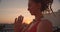 Closeup side view portrait of spiritual female with dreadlocks practicing yoga smiling cheerfully on rooftop with