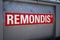 Closeup of sign at container with logo lettering of Remondis recycling company