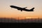 Closeup silhouette takeoff plane while dawn