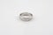 Closeup of a silver ring with simple patterns isolated on a white background