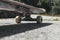 Closeup of a skateboard on the ground under the sunlight with a blurry background