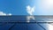 A closeup of a sleek solar panel on the roof reflecting the bright blue sky as it efficiently captures solar energy