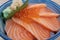 Closeup Sliced salmon top with Ikura decorated with green Shiso and fresh wasabi served at local Japanese restaurant. Popular