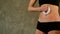 Closeup slim girl in black makes belly anticellulite massage