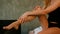 Closeup slim girl in black underwear makes leg self-massage