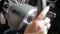 Closeup slow motion footage of female drivers hands on car steering wheel