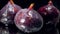 Closeup slow motion video of water droplets falling on fresh ripe figs against black background. Perfect abstract shot