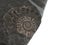 Closeup of small ammonite prehistoric fossil on stone. Found on Jurassic Coast, near Lyme Bay, UK. Archeology