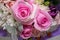 Closeup of a small bouquet with miniature pink roses