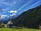 Closeup of a small church in Bolzano surrounded by the scenic nature of the Dolomitesround