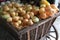 Closeup of a small wagon full of white fresh onions