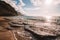 Closeup of the small waves on the beach at the island of Kauai near Na Pali cliffs during sunset