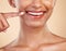 Closeup, smile and mouth of woman in studio for dental, cleaning and hygiene treatment on brown background. Zoom, lips