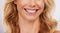 Closeup, smile and woman mouth in studio for dental, hygiene or teeth whitening on grey background. Oral, zoom and