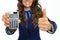 Closeup on smiling business woman showing calculator and thumbs