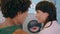 Closeup smiling lovers talk in public laundromat. Affectionate couple flirting