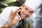 Closeup of a smiling male cook gesturing okay sign