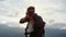 Closeup smiling traveler photographing nature. Tourist shoot mountains view.