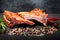 Closeup smoked ribs with spices, rosemary and chili pepper