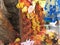 Closeup of Snake Statue in stone or Nagara Kallu in a Temple under the Pipal Tree doing puja during festival