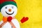 Closeup snowman over blurred gold background