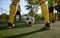 Closeup soccer ball and sportsman legs over grass football field