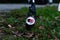 Closeup of a soda can clipped between the jaws of a trash picker