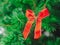 Closeup Soft focus red ribbon decorate on christmas tree. ChristmasDay Background