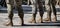 Closeup of Soldiers in a row. Detail of Military boots and camouflage uniforms