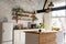 Closeup of a spacious loft industrial open space kitchen studio interior with big windows and sunlight