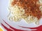Closeup spaghetti Bolognese with tomato sauce, copyspace.
