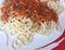closeup spaghetti Bolognese with tomato sauce, copyspace. horizontal photo.