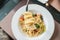 Closeup Spaghetti with Cutlery on white plate . Italian food