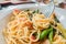 Closeup Spaghetti with Cutlery on white plate . Italian food